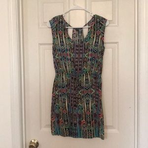 Multi-color dress with open back detail.